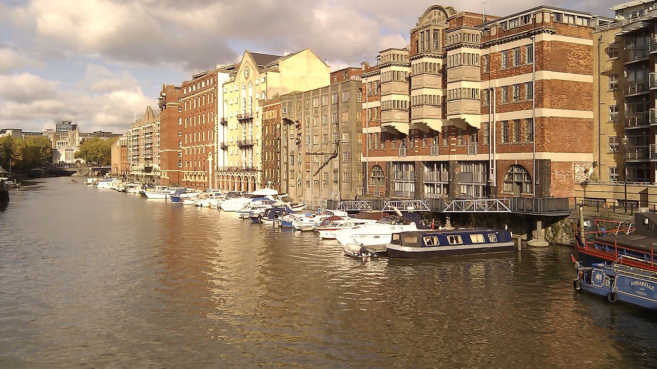 Brick warehouses and moored boats along Bristol’s Floating Harbour