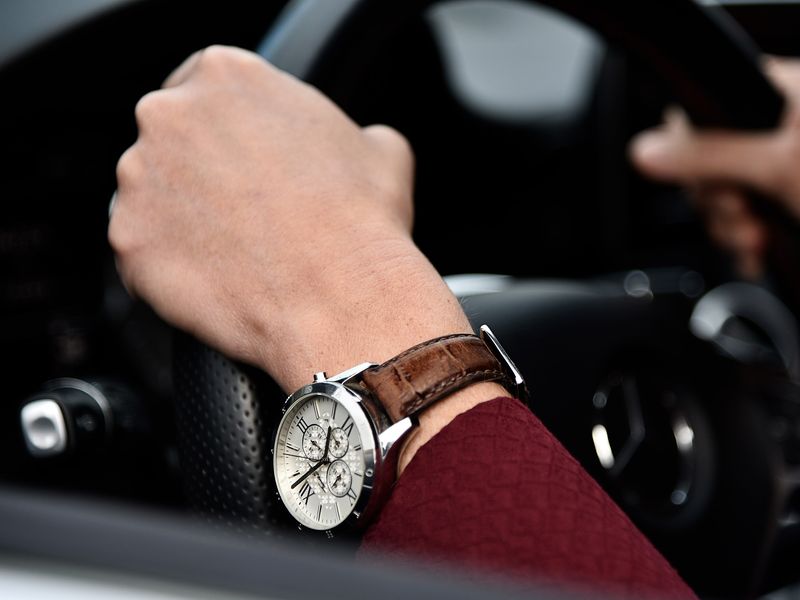 A driver's hands on the steering wheel