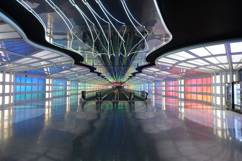 The lit walkway tunnel between O'Hare's C concourse and Terminal 1