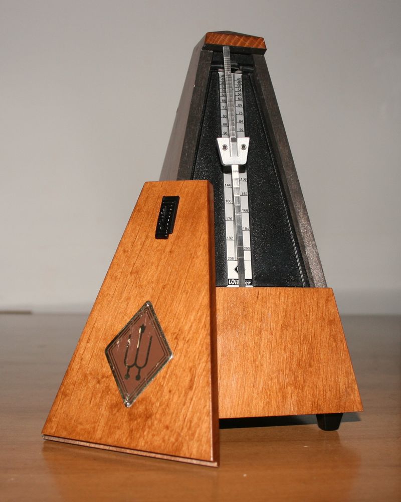 A wooden pyramid metronome