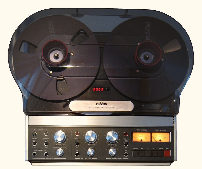 A reel-to-reel tape recorder with two spools of tape