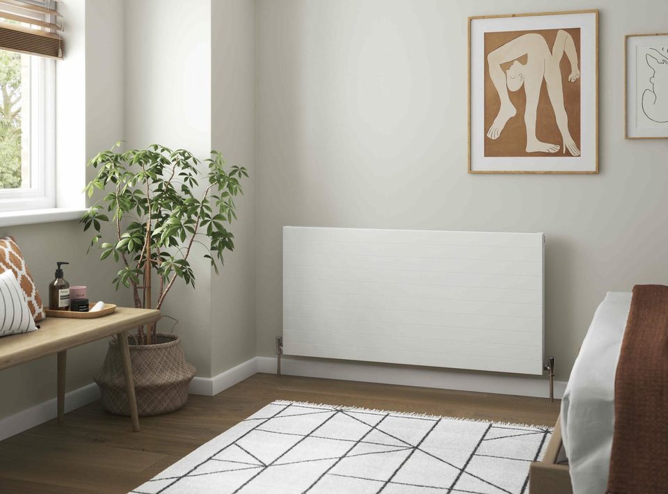 A low horizontal radiator under a bedroom window