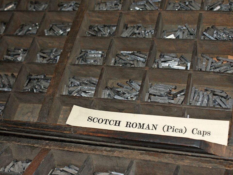 A type case labelled Scotch Roman, the compartments full of metal sorts