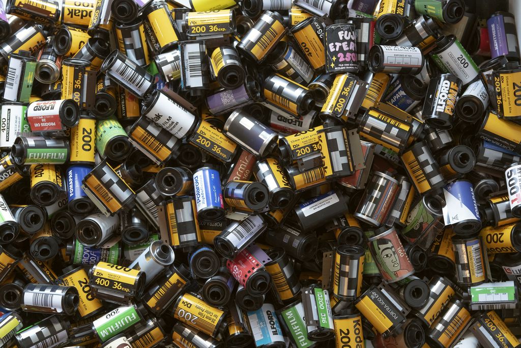 A heap of 35mm film canisters in many colours