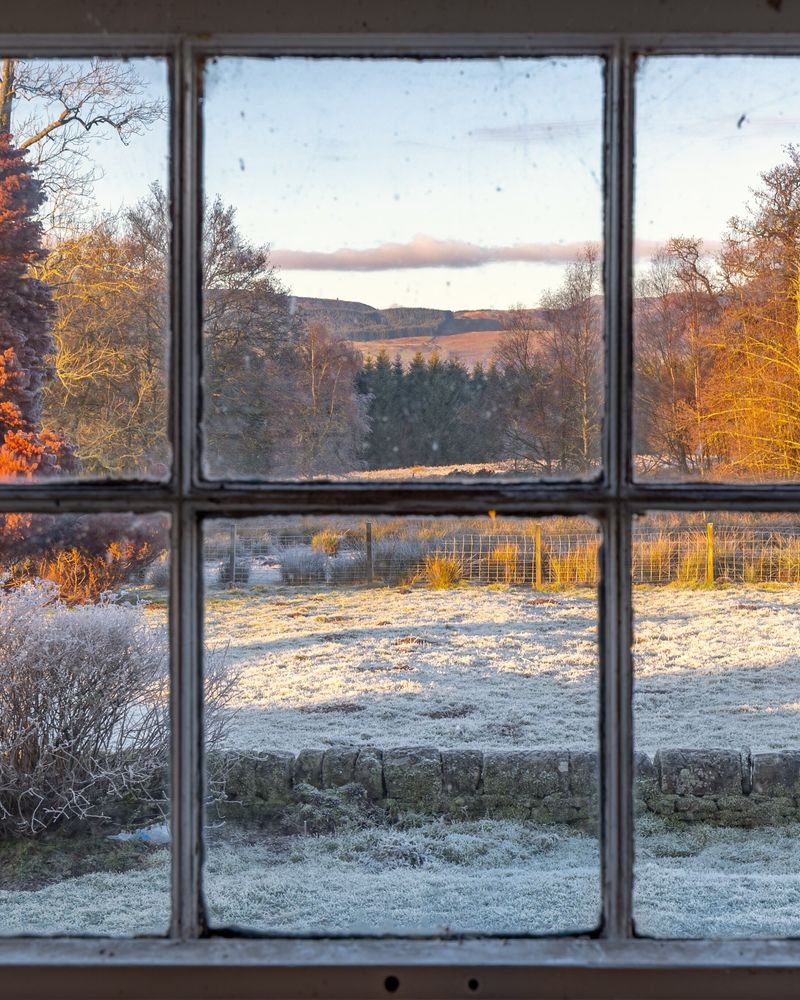 A frosty evening seen through a farmhouse window