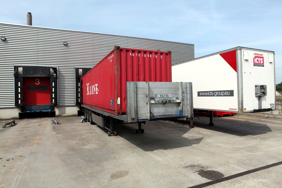 Trailers backed onto a warehouse loading dock