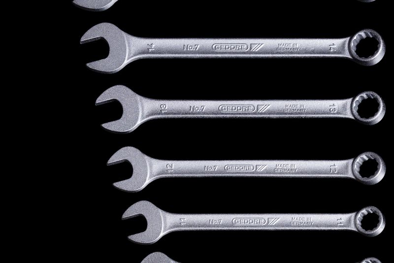 A set of combination spanners laid out in size order on a black background