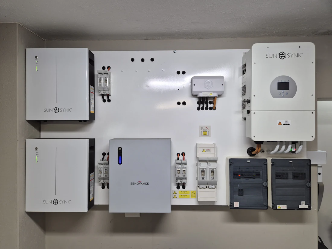 A home battery and inverter fitted to a wall