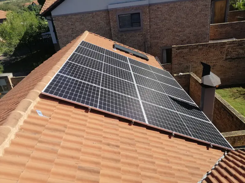 Solar panels on a terracotta tile roof